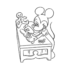 Mickey Mouse haciendo galletas de jengibre en la mesa