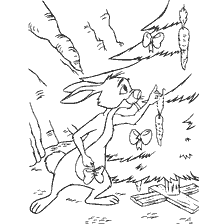 Disney rabbit decorates the Christmas tree with carrots with ribbons.